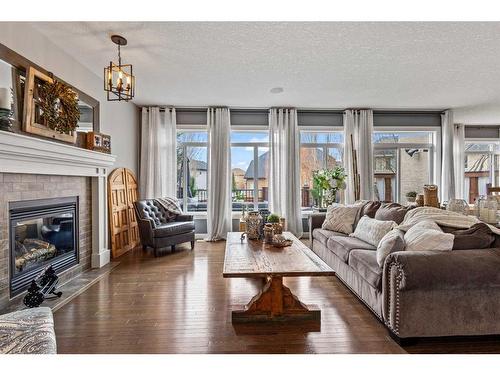 51 Tuscany Estates Close Nw, Calgary, AB - Indoor Photo Showing Living Room With Fireplace