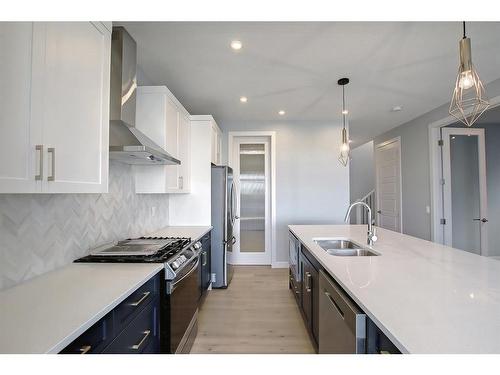 56 Precedence View, Cochrane, AB - Indoor Photo Showing Kitchen With Double Sink With Upgraded Kitchen