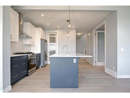 56 Precedence View, Cochrane, AB - Indoor Photo Showing Kitchen With Upgraded Kitchen