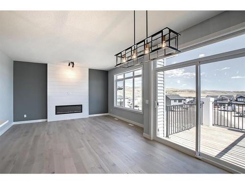 56 Precedence View, Cochrane, AB - Indoor With Fireplace