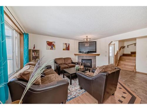 94 Cranfield Green Se, Calgary, AB - Indoor Photo Showing Living Room With Fireplace