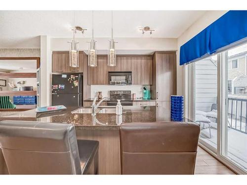 67 Silverado Way Sw, Calgary, AB - Indoor Photo Showing Kitchen With Double Sink