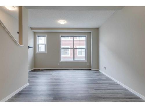 35 New Brighton Point Se, Calgary, AB - Indoor Photo Showing Other Room