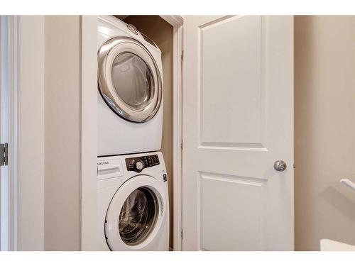 35 New Brighton Point Se, Calgary, AB - Indoor Photo Showing Laundry Room