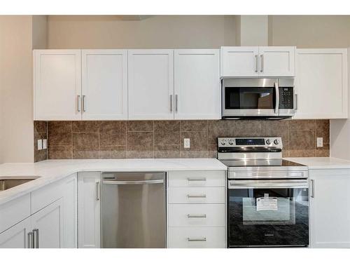 35 New Brighton Point Se, Calgary, AB - Indoor Photo Showing Kitchen With Upgraded Kitchen