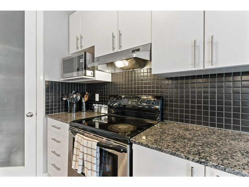 159 Panamount Circle Nw, Calgary, AB - Indoor Photo Showing Kitchen With Upgraded Kitchen