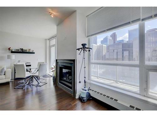 1626-222 Riverfront Avenue Sw, Calgary, AB - Indoor With Fireplace