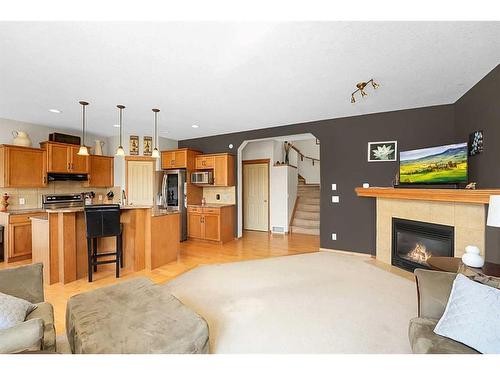 98 Chapman Close Se, Calgary, AB - Indoor With Fireplace