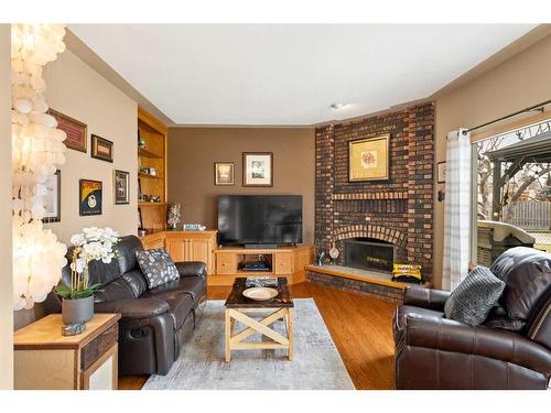 208 Templevale Place Ne, Calgary, AB - Indoor Photo Showing Living Room With Fireplace
