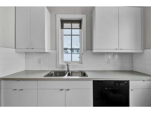 16 Hong Kong Road Sw, Calgary, AB - Indoor Photo Showing Kitchen With Double Sink
