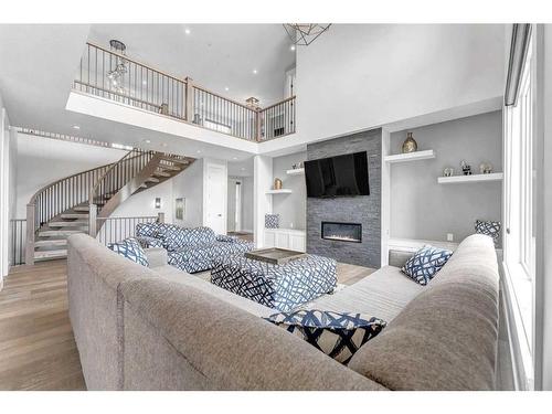 26 Chelsea Bay, Chestermere, AB - Indoor Photo Showing Living Room With Fireplace