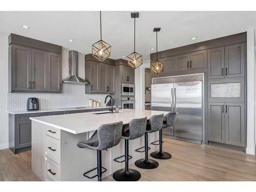 26 Chelsea Bay, Chestermere, AB - Indoor Photo Showing Kitchen With Upgraded Kitchen