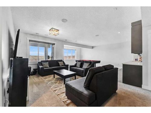 26 Chelsea Bay, Chestermere, AB - Indoor Photo Showing Living Room