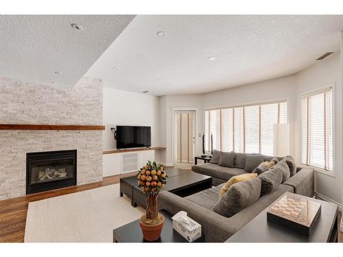 34 Discovery Rise Sw, Calgary, AB - Indoor Photo Showing Living Room With Fireplace