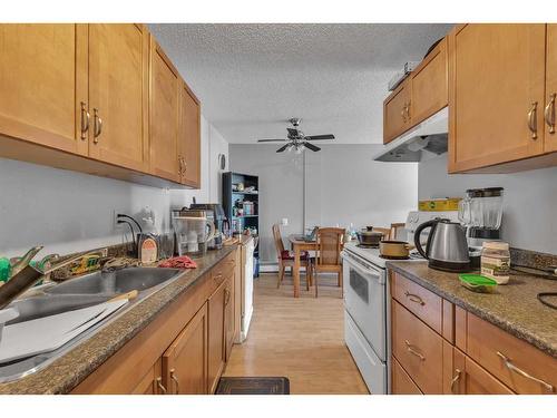 401-3420 50 Street Nw, Calgary, AB - Indoor Photo Showing Kitchen With Double Sink
