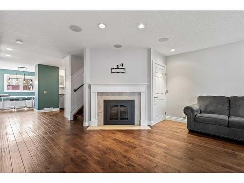 4521 Bowness Road Nw, Calgary, AB - Indoor Photo Showing Living Room With Fireplace
