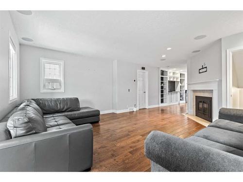 4521 Bowness Road Nw, Calgary, AB - Indoor Photo Showing Living Room With Fireplace