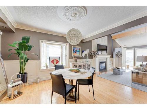 338 Superior Avenue Sw, Calgary, AB - Indoor Photo Showing Dining Room With Fireplace