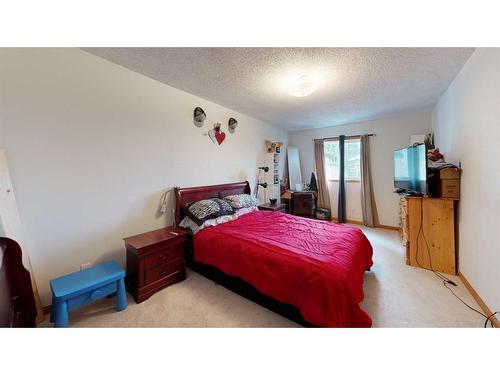 1502 26 Avenue, Nanton, AB - Indoor Photo Showing Bedroom