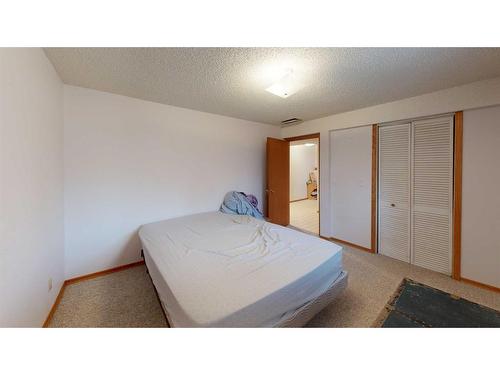1502 26 Avenue, Nanton, AB - Indoor Photo Showing Bedroom