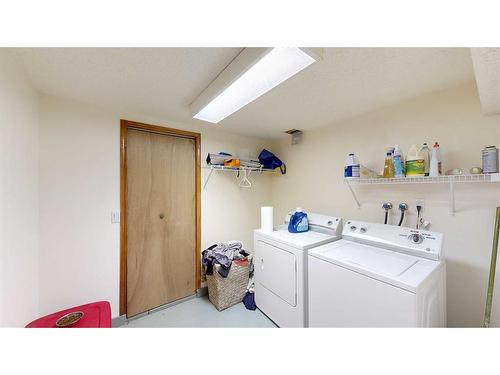 1502 26 Avenue, Nanton, AB - Indoor Photo Showing Laundry Room