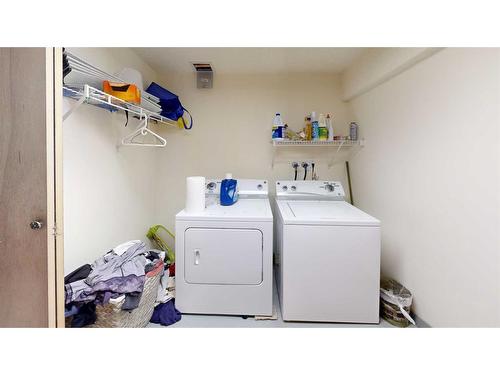 1502 26 Avenue, Nanton, AB - Indoor Photo Showing Laundry Room