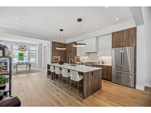 114 Valour Circle Sw, Calgary, AB - Indoor Photo Showing Kitchen With Upgraded Kitchen