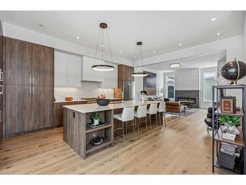 114 Valour Circle Sw, Calgary, AB - Indoor Photo Showing Kitchen With Upgraded Kitchen