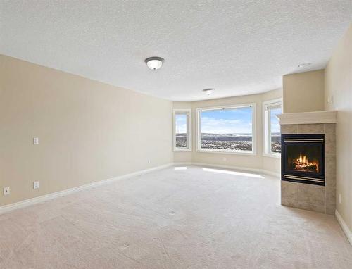 315 Rocky Ridge Drive Nw, Calgary, AB - Indoor With Fireplace