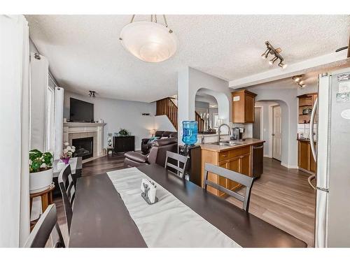 12-117 Bow Ridge Drive, Cochrane, AB - Indoor With Fireplace