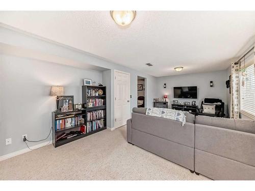 12-117 Bow Ridge Drive, Cochrane, AB - Indoor Photo Showing Living Room