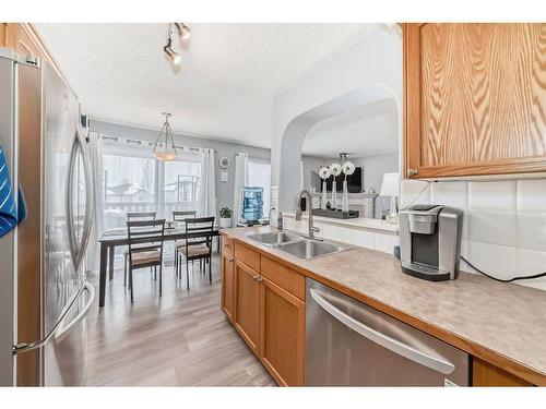 12-117 Bow Ridge Drive, Cochrane, AB - Indoor Photo Showing Kitchen With Double Sink