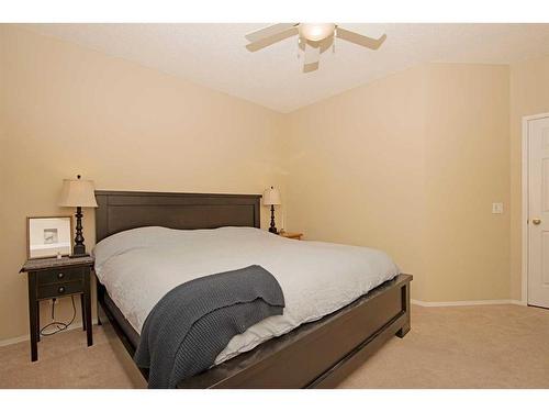 15 Cimarron Crescent, Okotoks, AB - Indoor Photo Showing Bedroom
