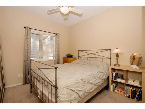 15 Cimarron Crescent, Okotoks, AB - Indoor Photo Showing Bedroom