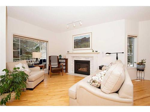 15 Cimarron Crescent, Okotoks, AB - Indoor Photo Showing Living Room With Fireplace