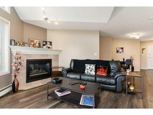 406-20 Sierra Morena Mews Sw, Calgary, AB - Indoor Photo Showing Living Room With Fireplace