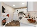 406-20 Sierra Morena Mews Sw, Calgary, AB  - Indoor Photo Showing Kitchen With Double Sink 