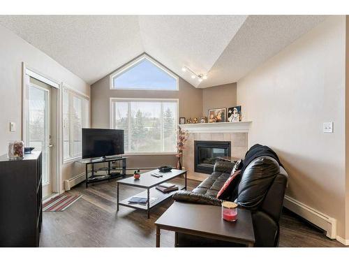 406-20 Sierra Morena Mews Sw, Calgary, AB - Indoor Photo Showing Living Room With Fireplace