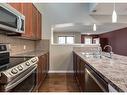 158 Auburn Bay Heights Se, Calgary, AB  - Indoor Photo Showing Kitchen With Double Sink 