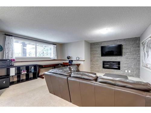 129 Royal Oak Heath Nw, Calgary, AB - Indoor Photo Showing Other Room With Fireplace