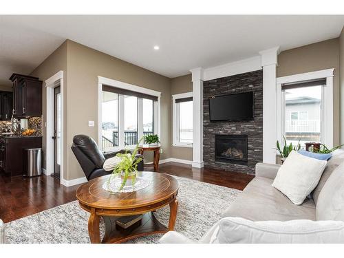 6 Keown Close, Olds, AB - Indoor Photo Showing Living Room With Fireplace