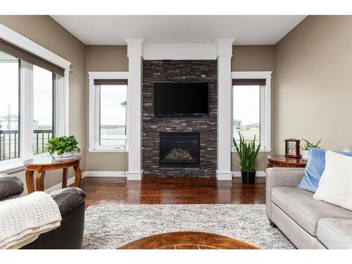 6 Keown Close, Olds, AB - Indoor Photo Showing Living Room With Fireplace