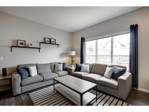 79 Copperpond Square Se, Calgary, AB - Indoor Photo Showing Living Room