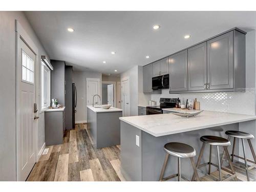 65 Meadowview Road Sw, Calgary, AB - Indoor Photo Showing Kitchen With Upgraded Kitchen