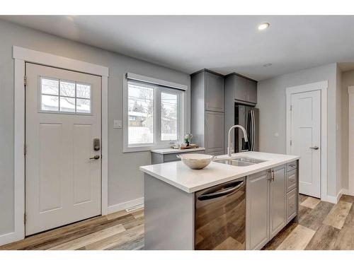 65 Meadowview Road Sw, Calgary, AB - Indoor Photo Showing Kitchen With Double Sink