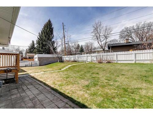 65 Meadowview Road Sw, Calgary, AB - Outdoor With Backyard