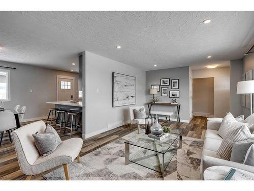 65 Meadowview Road Sw, Calgary, AB - Indoor Photo Showing Living Room