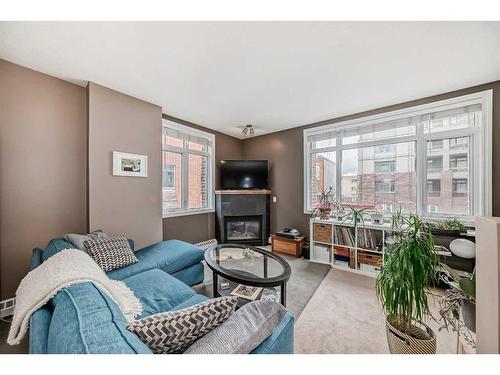 233-910 Centre Avenue, Calgary, AB - Indoor Photo Showing Living Room With Fireplace