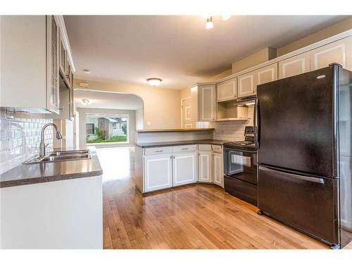 214 21 Avenue Nw, Calgary, AB - Indoor Photo Showing Kitchen With Double Sink