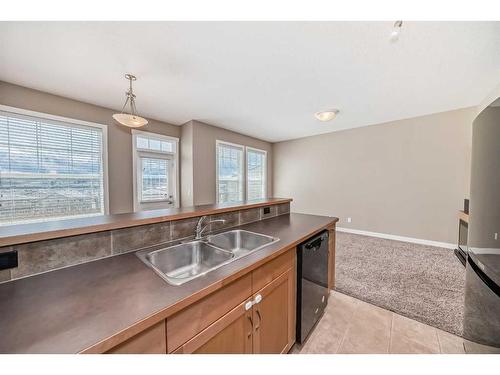 51-28 Heritage Drive, Cochrane, AB - Indoor Photo Showing Kitchen With Double Sink